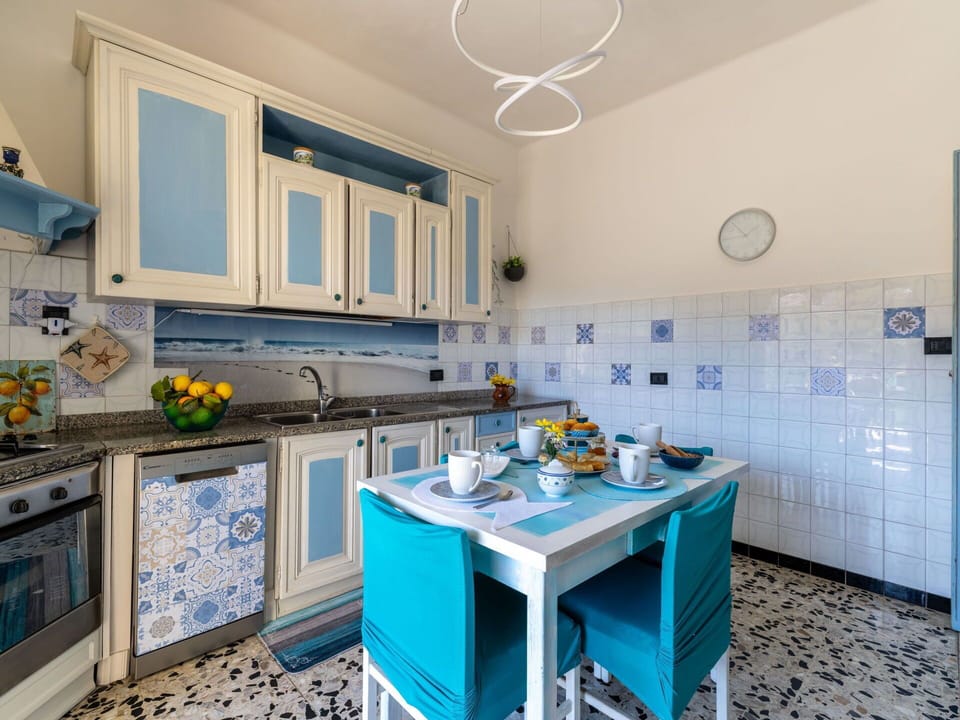 Interior Design, Flooring, Floor, Furniture, Kitchen, Room, Countertop, Major Appliance, Dining Room, Chair