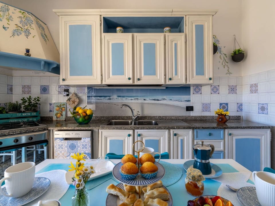 Blue, Interior Design, Furniture, Tableware, Room, Flooring, Kitchen, Dining Room, Lighting, Table