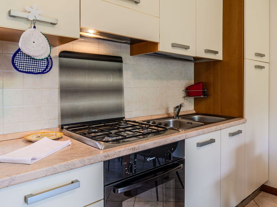 Kitchen Appliance, Kitchen, Countertop, Major Appliance, Kitchen Stove, Stove, Cabinetry, Home Appliance, Wood, Kitchen Sink