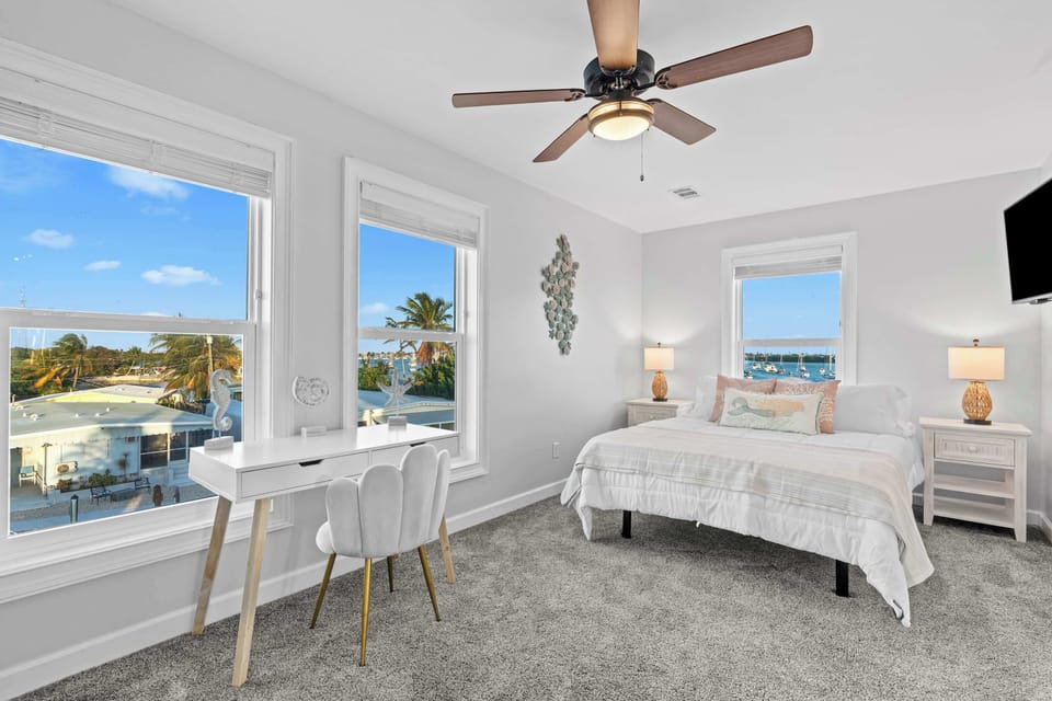 Wake up to breathtaking water views and stylish coastal decor!