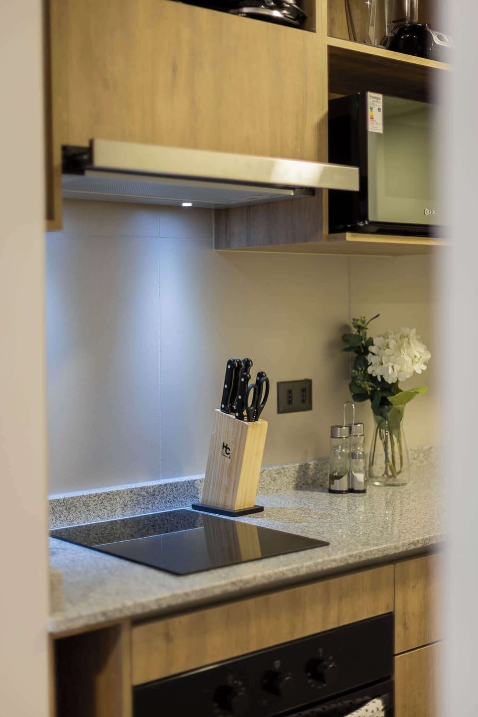 Sleek and modern kitchen with top-notch appliances and stylish decor, perfect for culinary adventures.