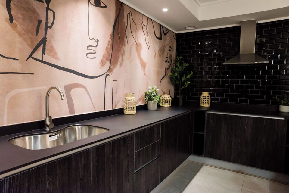 Stylish kitchen with artistic flair and modern amenities, perfect for culinary creativity.
