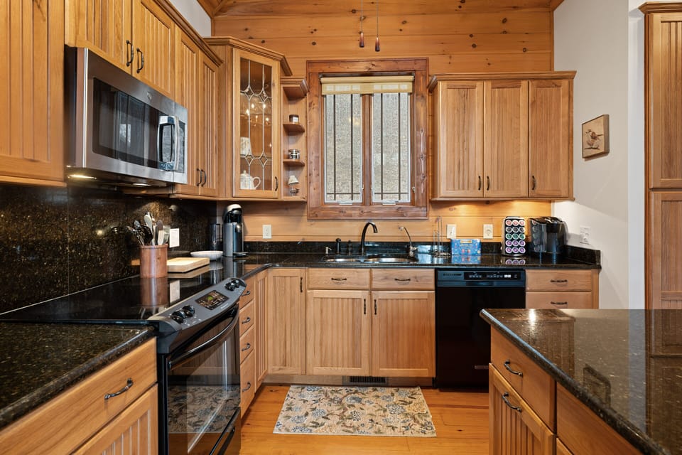 Open Kitchen with Granite Countertops and Custom Cabinetry