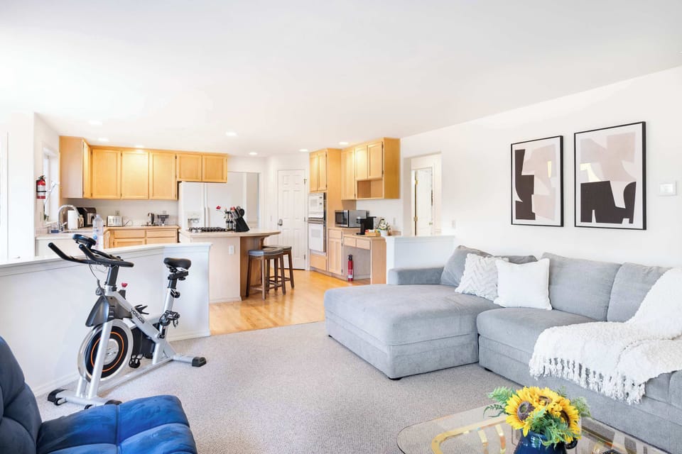 Includes an indoor exercise bike, stylish furniture, and plenty of natural light to enhance your stay.