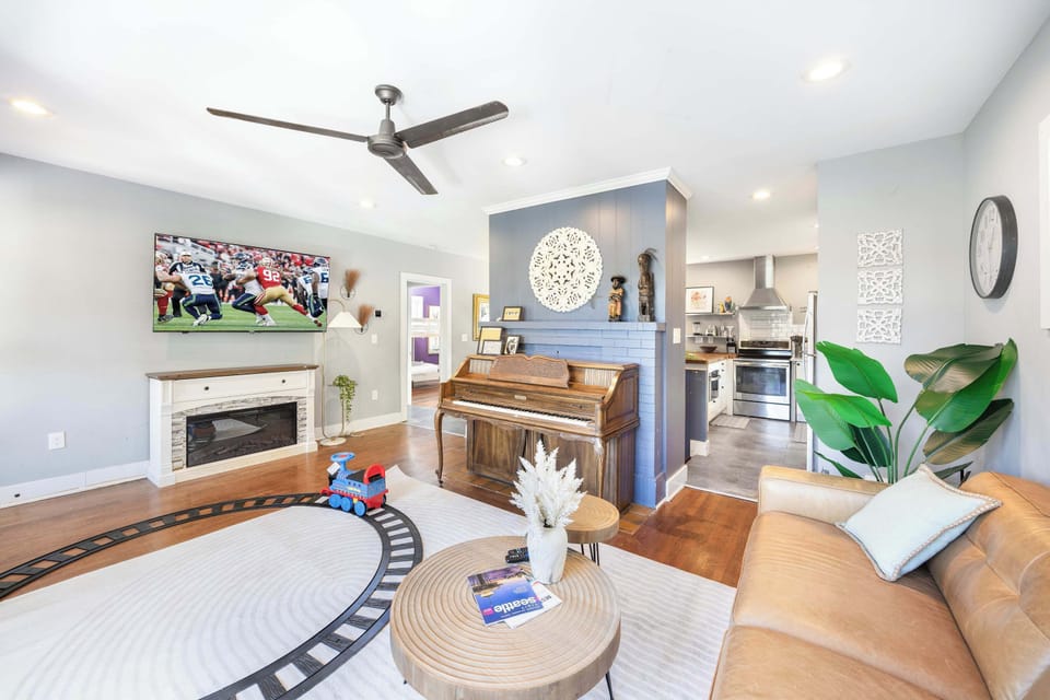 Step into our inviting living room, designed for relaxation and entertainment. Enjoy a movie night on the large flat-screen TV, or cozy up by the electric fireplace. 