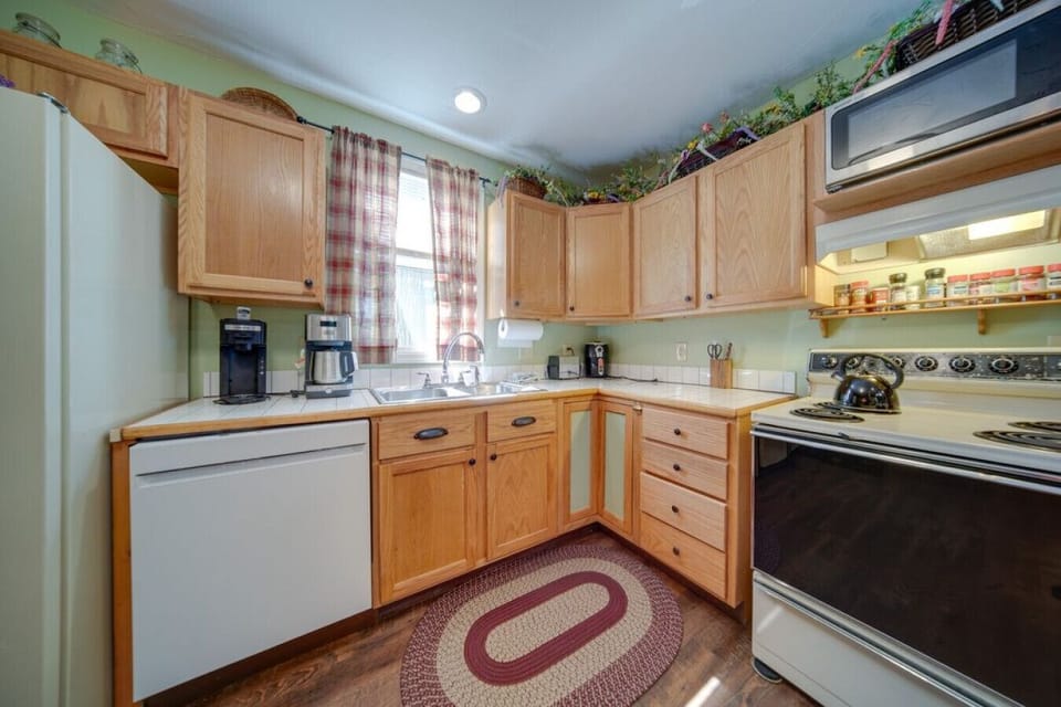 Whip up your favorite meals in this cozy kitchen, designed to make cooking easy and enjoyable.