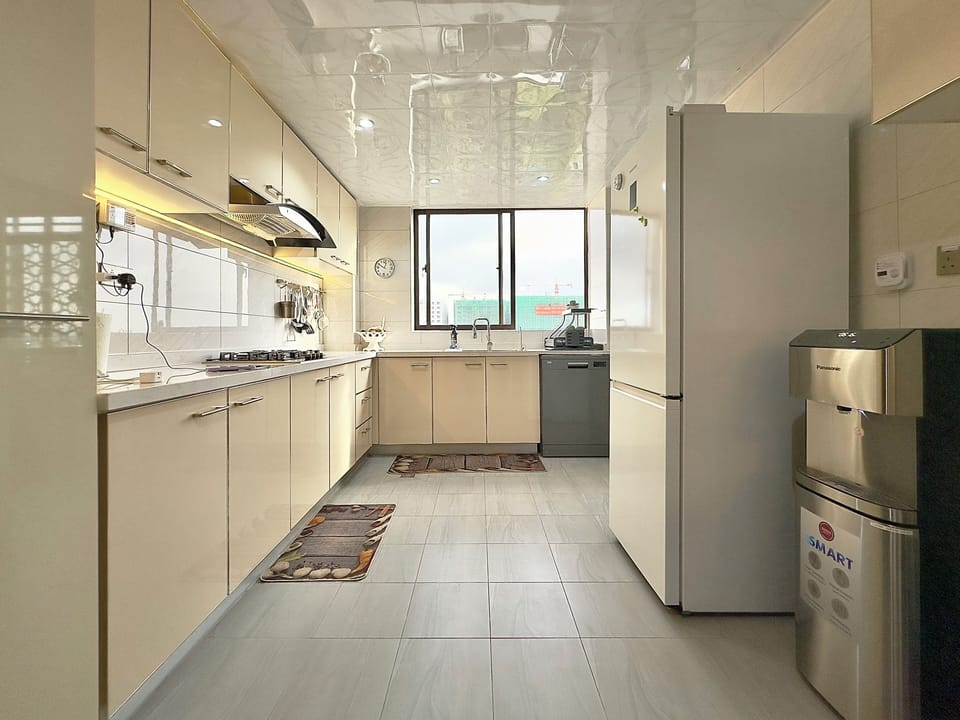 The spacious kitchen is light, has big windows, and lots of storage!