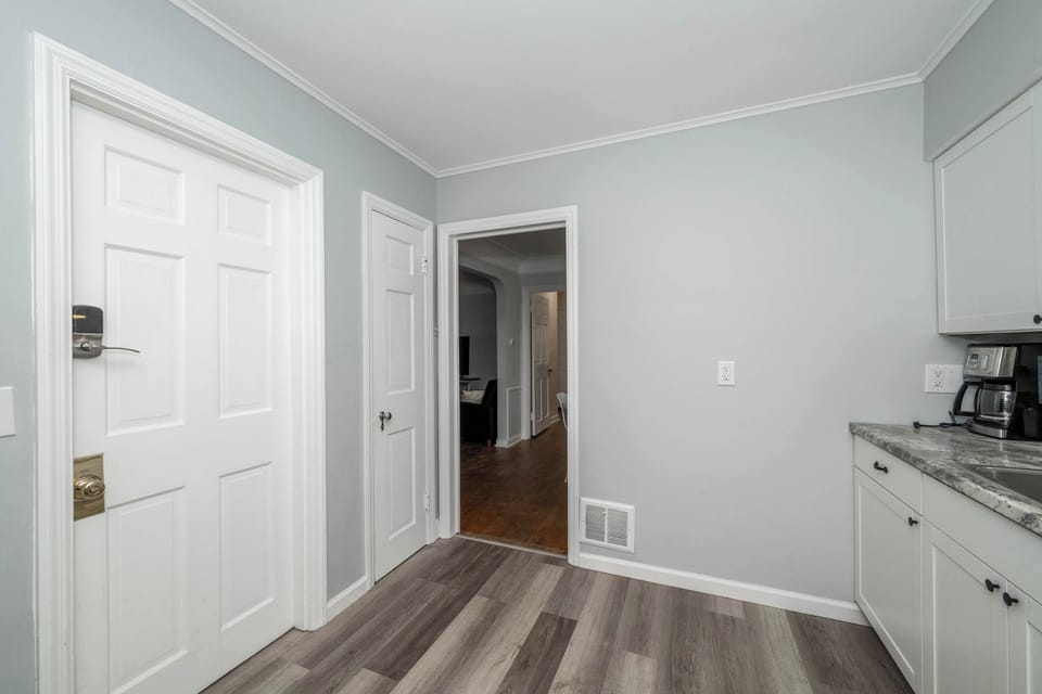 Apartment 1’s sleek kitchen offers ample space & all the comforts of home