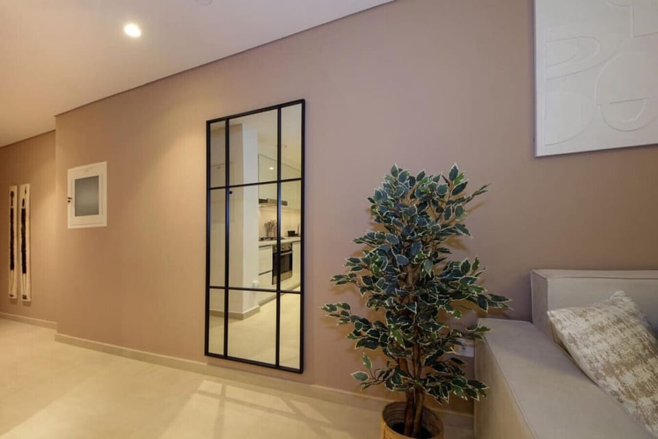 Living Room: Bright spaces with modern decor and a stylish mirror inviting relaxation!