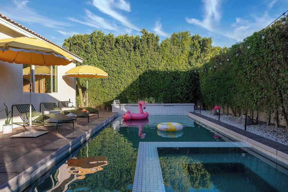 Pool and hot tub with sun loungers