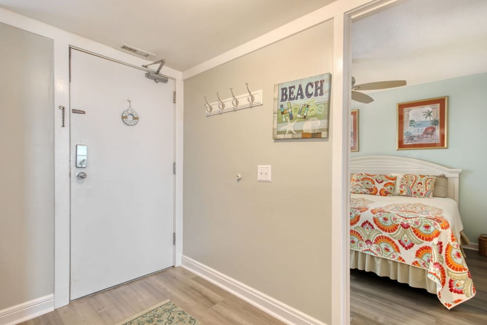 Entry & view of Guest suite #1 with Queen bed