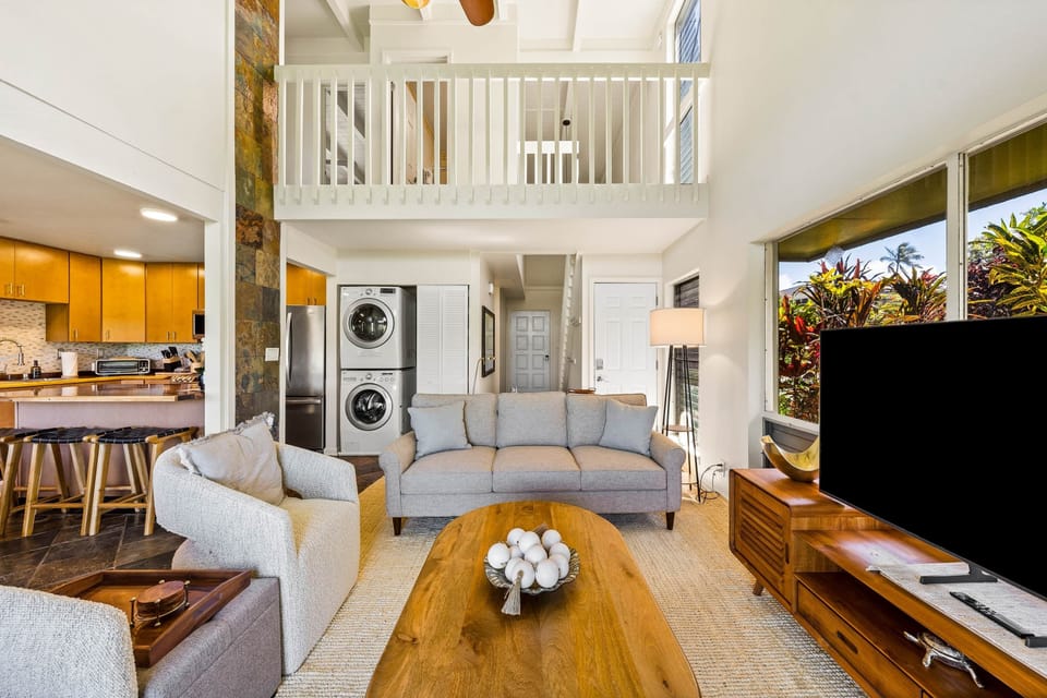 With a cozy sofa, sleek appliances, and abundant natural light, this home is perfect for relaxation 