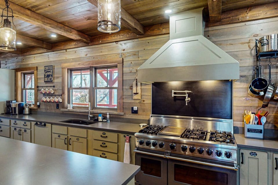 The kitchen features a large stove and fridge, perfect for cooking with large groups. Ask about adding a private chef for an extra special experience.