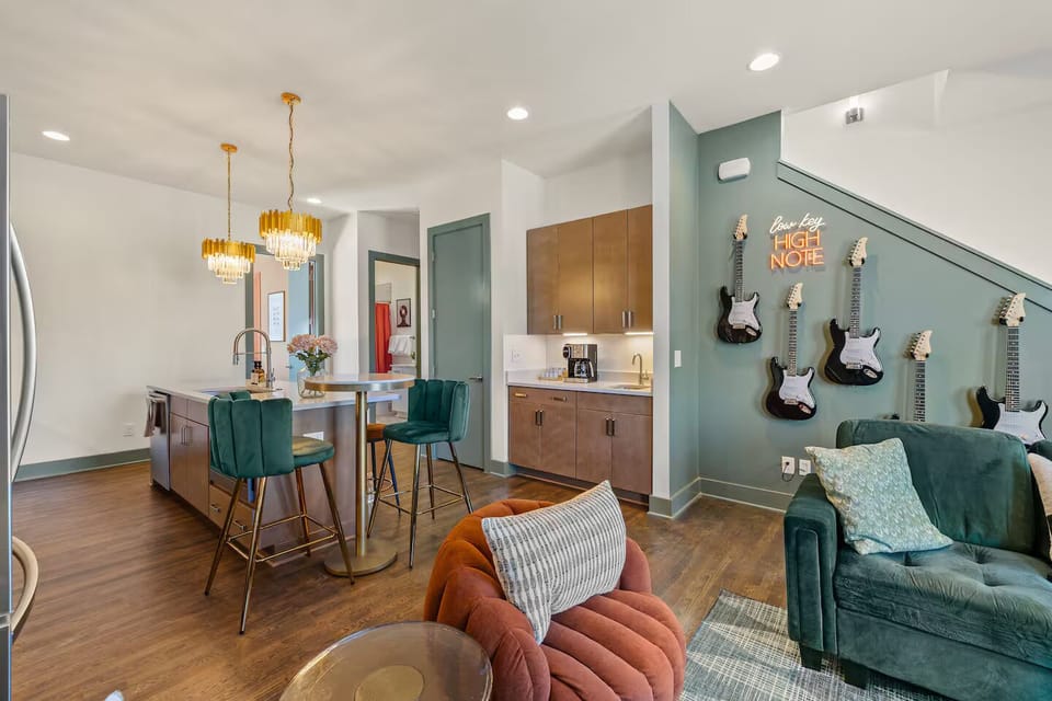 Host an intimate wine tasting in this elegant kitchen! The spacious island invites conversation, while the barstools provide seating for guests to unwind and savor exquisite wines under the glow of the chandelier.