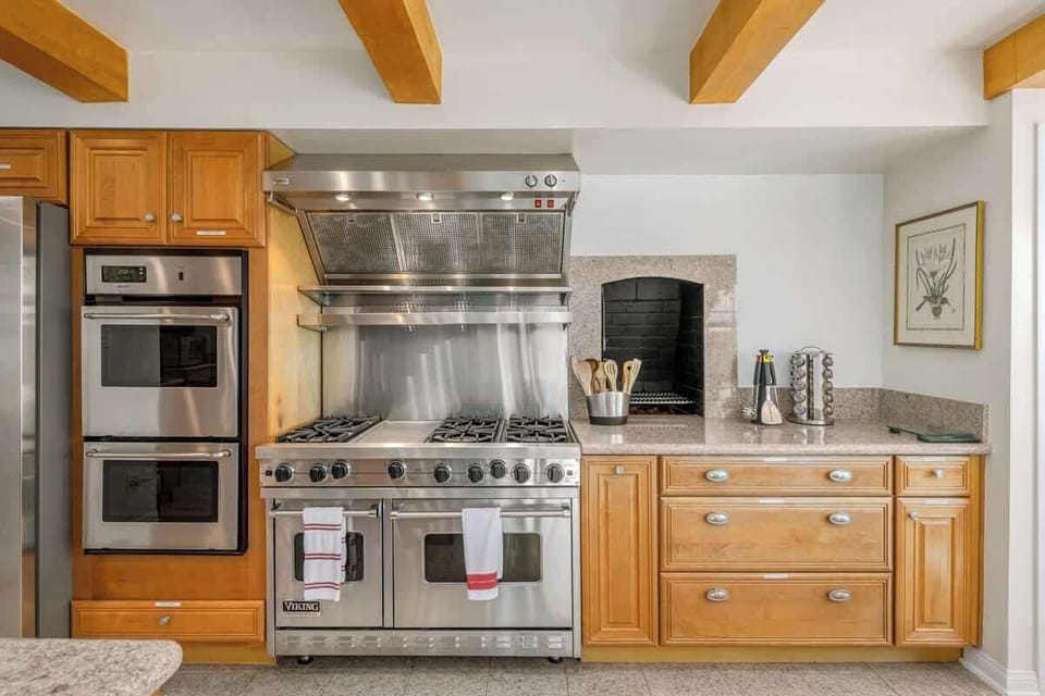 The Chef's kitchen is perfect for large family meals... It includes 4 Viking ovens, a wood fired pizza oven, Sub Zero refrigerator....