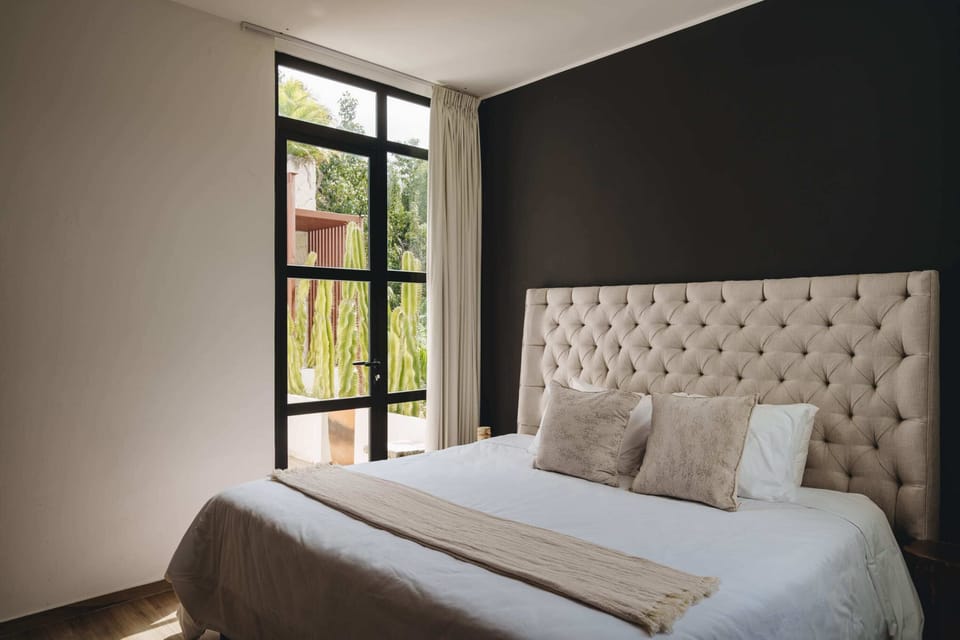 Spacious and elegant bedroom with a king-size bed.