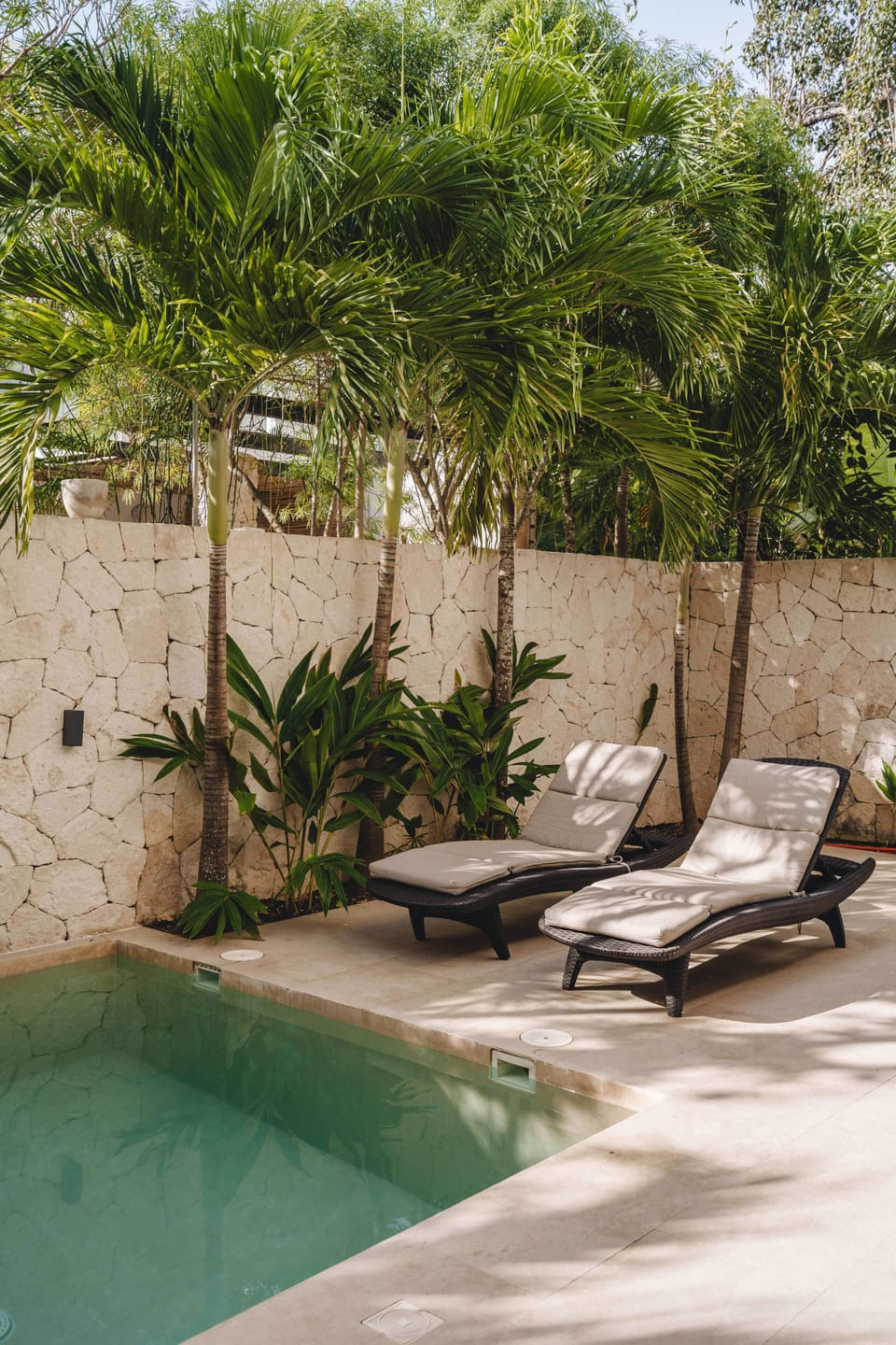 Comfortable loungers located on the ground floor, next to the pool.