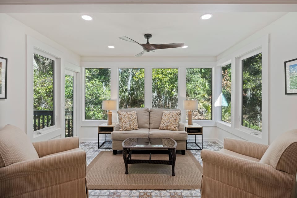 Spacious sunroom, perfect for an afternoon book!