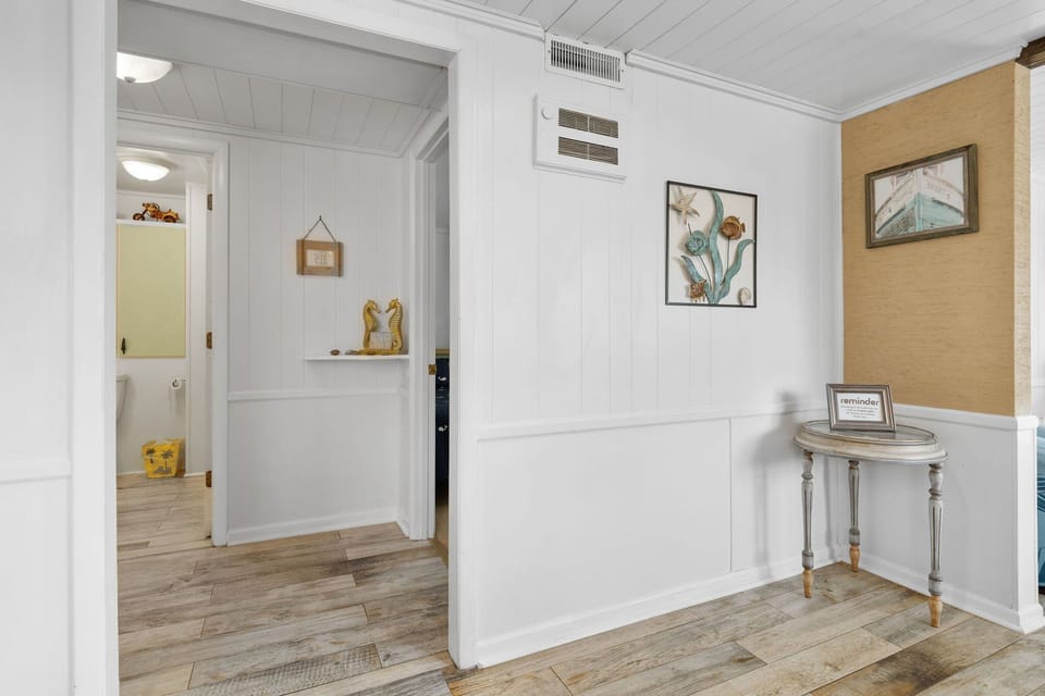 Inviting space adorned with beach-inspired decor—start your Surf City adventure here!