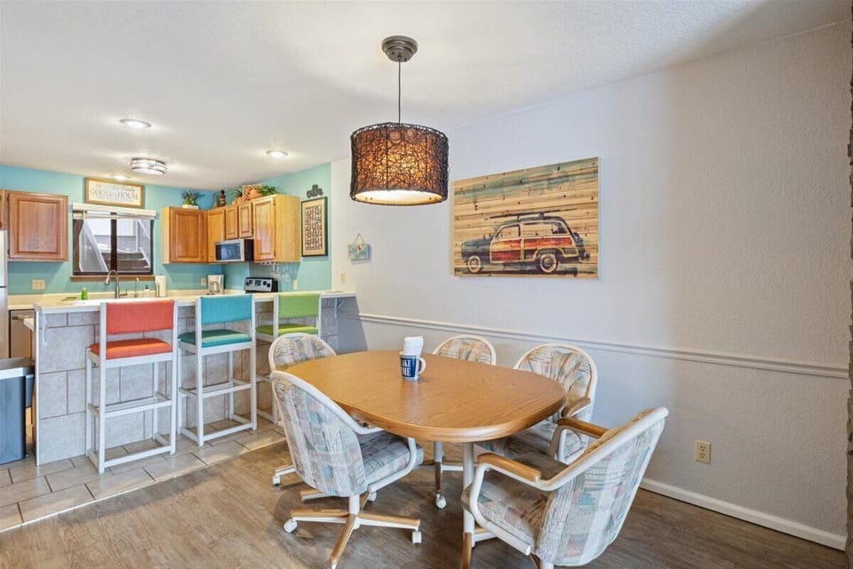 The eat-in kitchen showcases bright, lively colors with seating for 8.