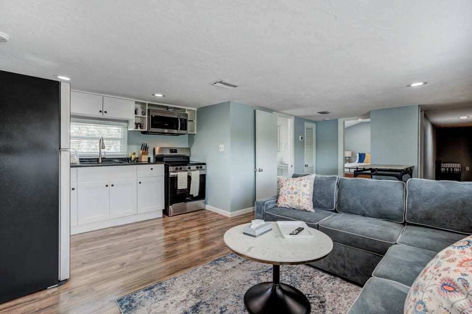 An open-concept layout seamlessly connects the living room to the fully equipped kitchen—perfect for cooking, dining, and relaxing all in one space.





