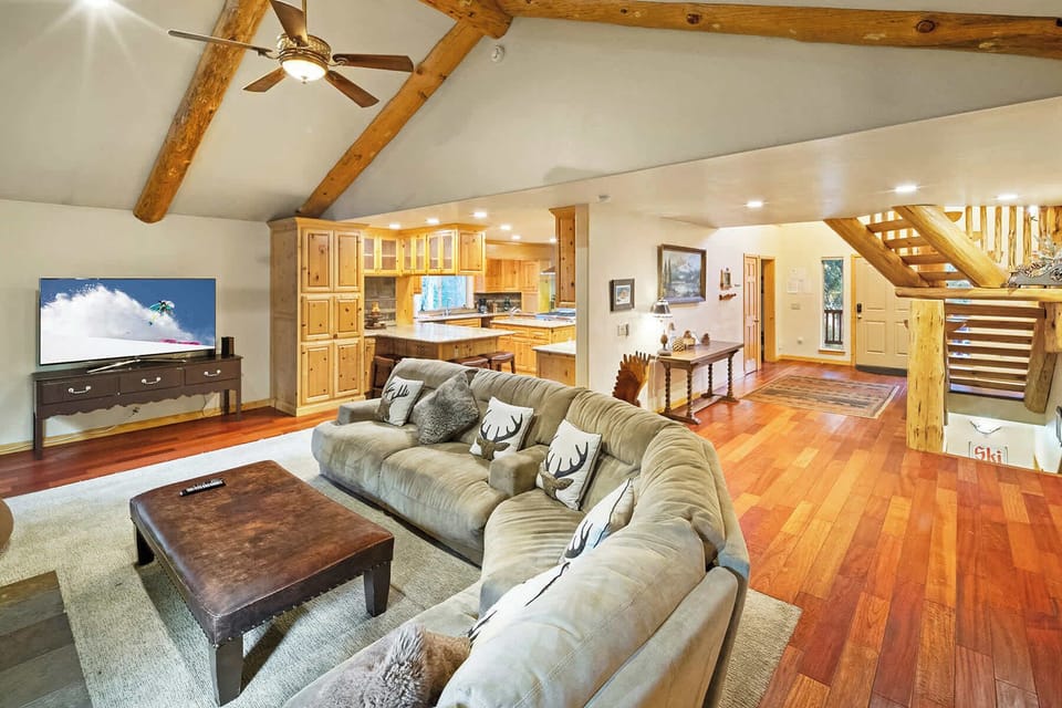 Living area on level floor opens up to bright granite cook's kitchen and dining area.