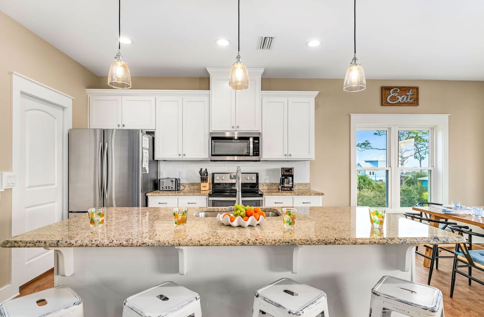 Seating for 10 at the dining room table and an additional seating for 4 at the kitchen bar