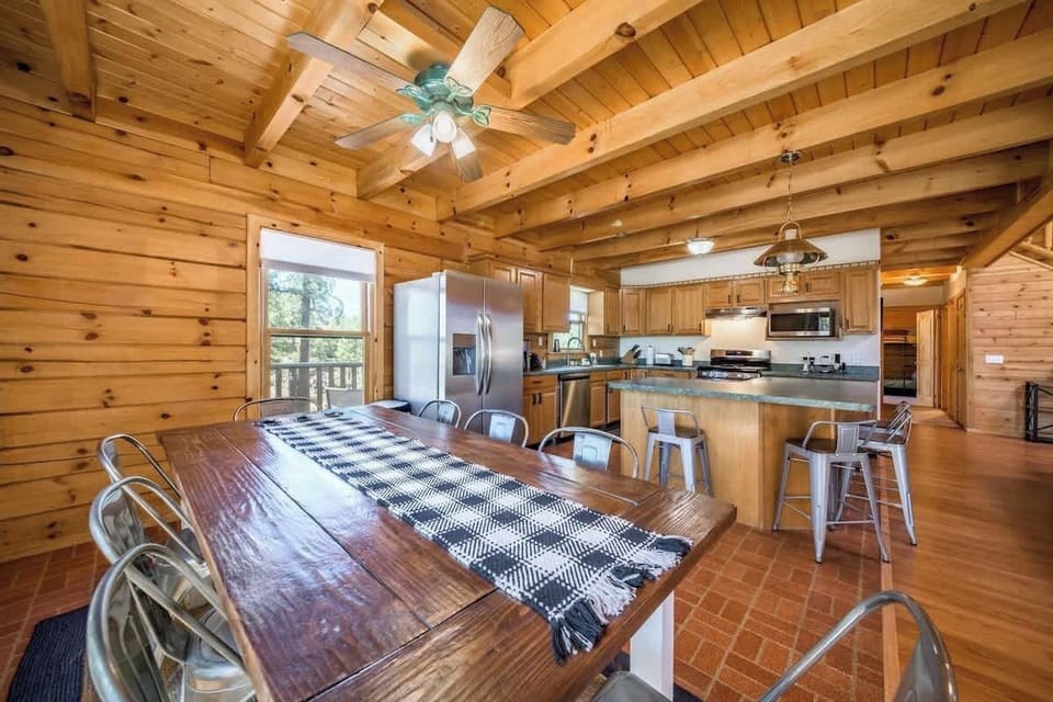 Enjoy a family meal with the entire group around our gorgeous, solid wood dining table with seating for up to eight with additional seating around the kitchen island!