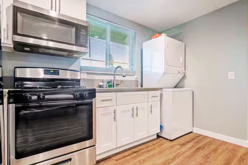 Modern kitchen with all essentials provided for a comfortable stay