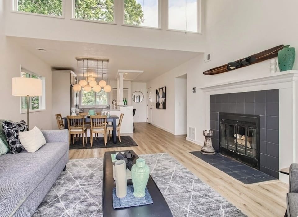 Living room looking toward kitchen.  upper windows give the condo amazing light.