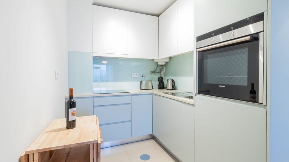 Small but mighty—this kitchenette is fully equipped for your stay! #ModernLiving #FunctionalDesign
