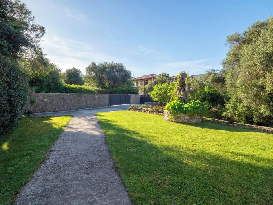 Entering the property, there is private parking space for 2-3 cars and a garden