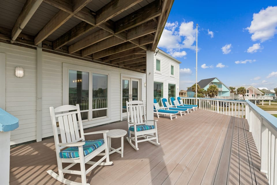 Large second level deck with plenty of seating to enjoy the ocean air and spectacular views.