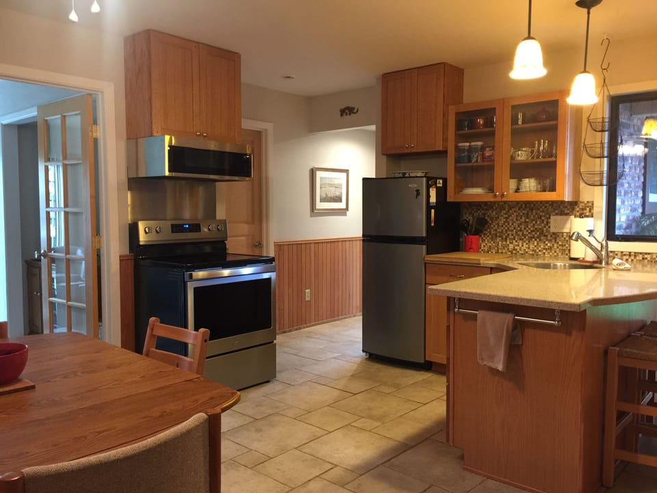 Kitchen.  Stove, oven, microwave, rice cooker, coffee bar, and more.
