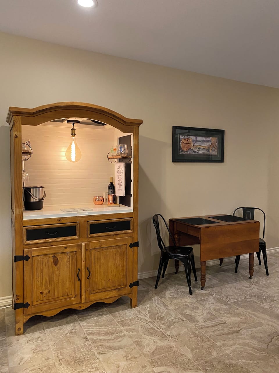 Bar Area with expanding table; 2 extra folding chairs in bedroom closet