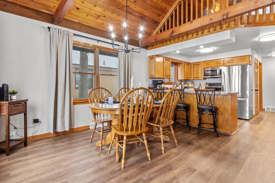 The open-concept design seamlessly connects the living, dining, and kitchen areas, creating a bright and inviting space.