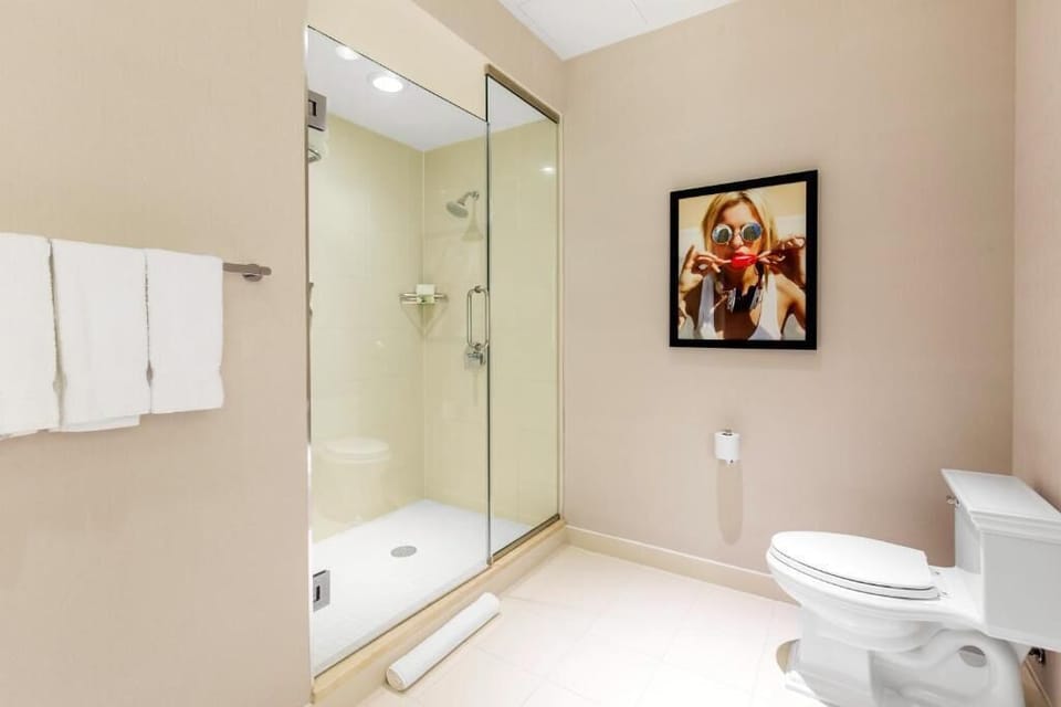 Refresh in a bright walk-in shower after exploring.