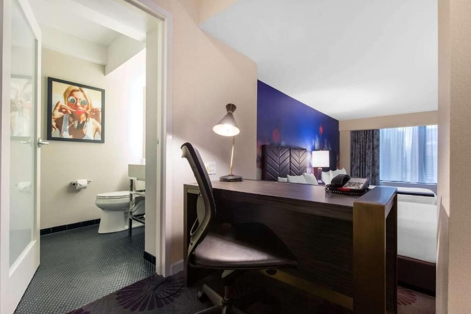 Get ready smoothly with a spacious desk and convenient bath access.