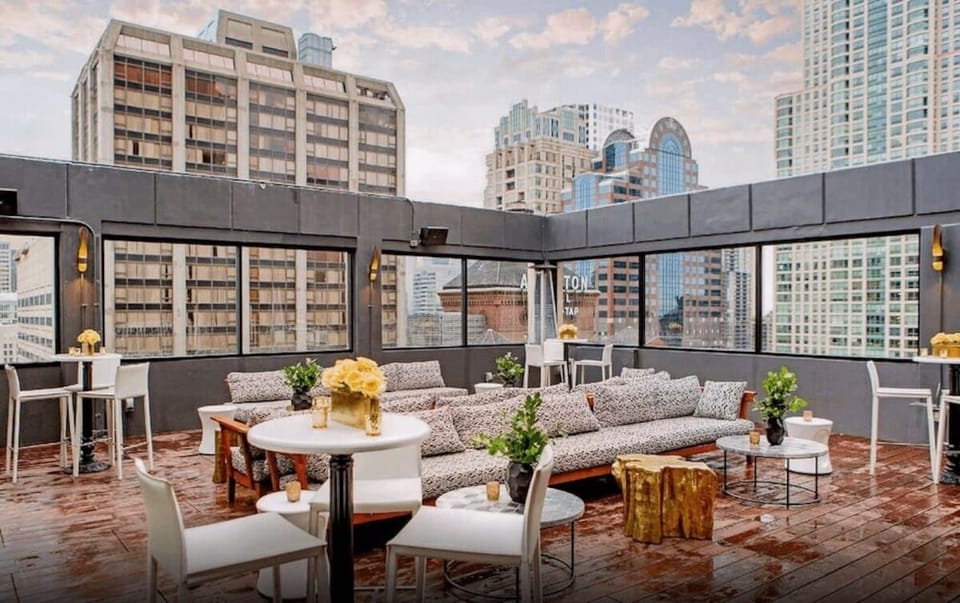 Unwind on the rooftop terrace with sparkling city views.