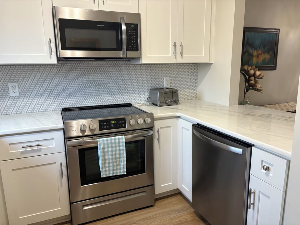 Kitchen appliances including dishwasher