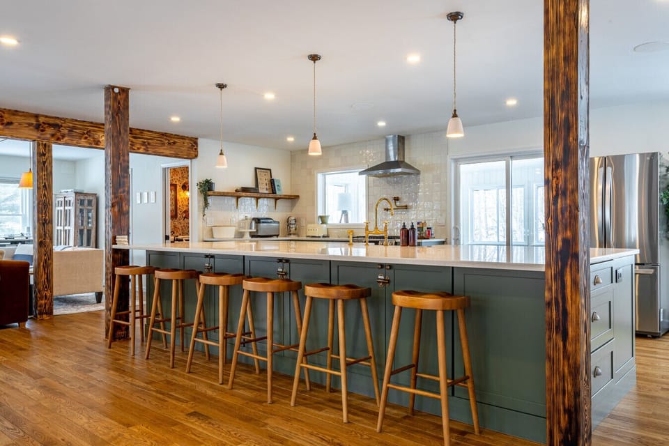 This beautiful kitchen includes a large island, perfect for food preparation and dining