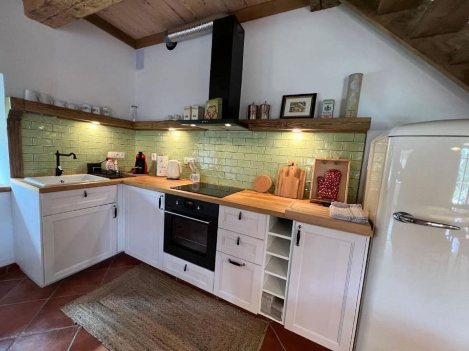 Kitchen, Countertop, Kitchen Appliance, Furniture, Interior Design, Cabinetry, Flooring, Major Appliance, Wood, Floor