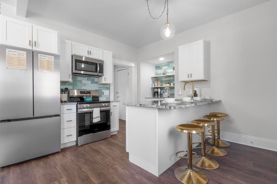 Unit A Kitchen featuring gold finishes and an elegant design