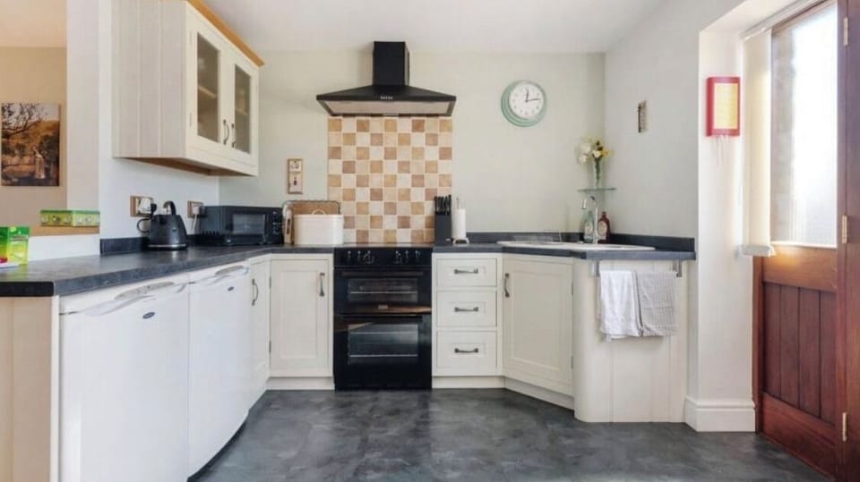 Modern shaker style kitchen with attached dining area 