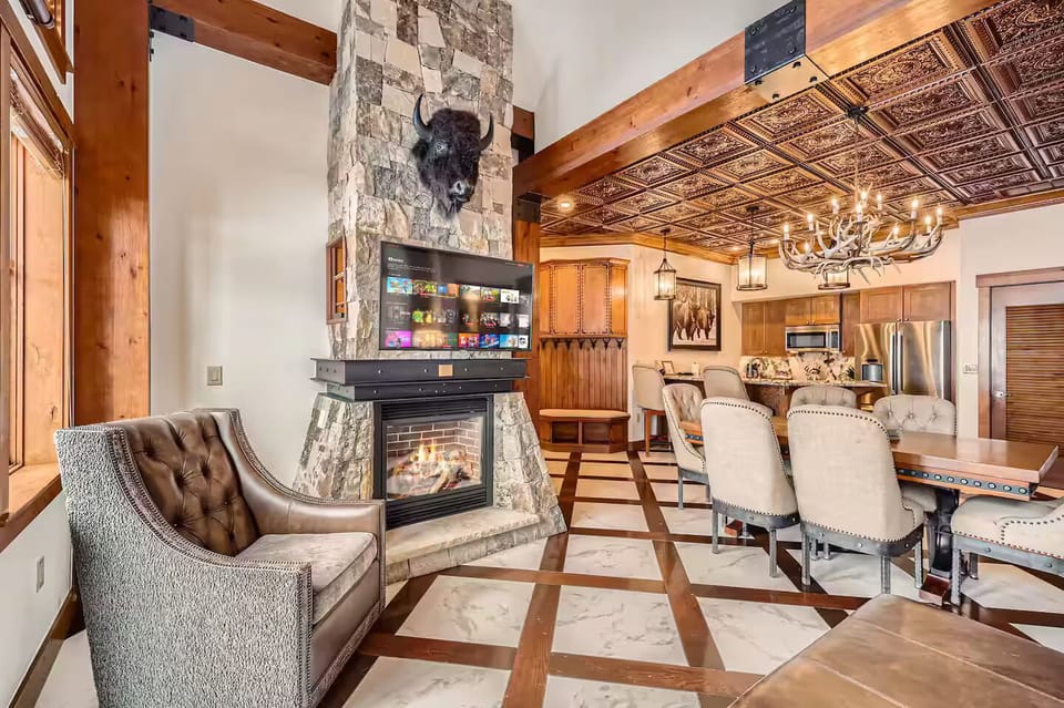 Lounge chairs near large windows and rustic decor