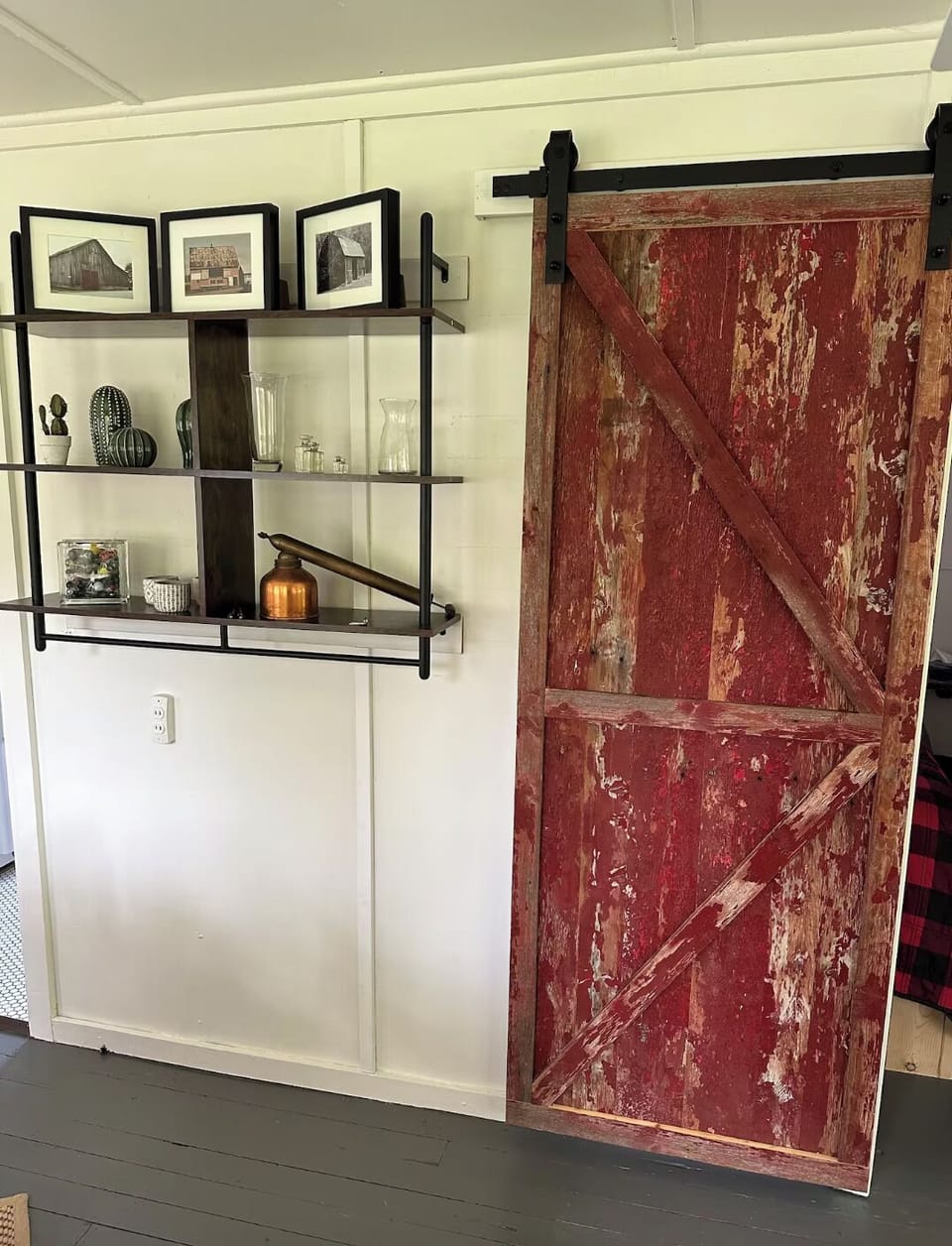 Recently renovated with rustic, sliding barn doors leading into cozy bedrooms.