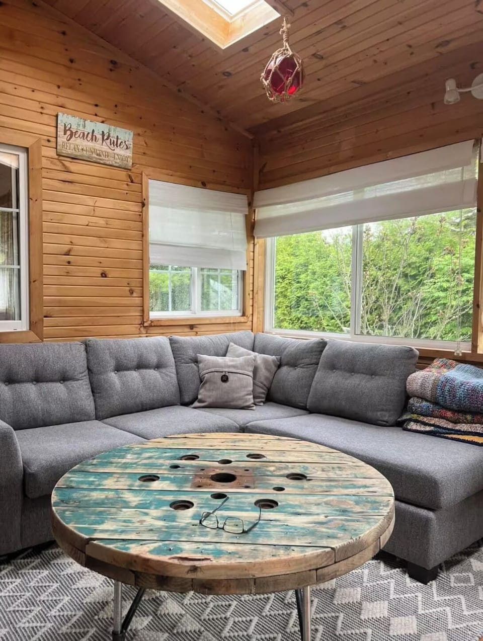 Family room with sunlights and Roku TV.