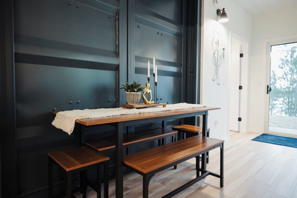 Dining table that can be tucked away when not in use to maximize space