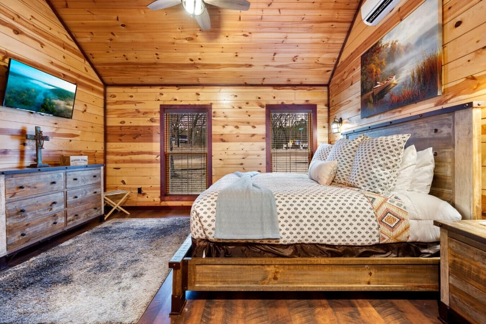 The cabin is designed as a romantic retreat with modern comforts and rustic charm.