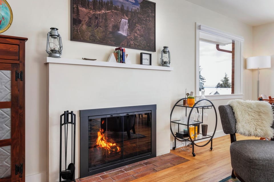 Wood fireplace in the main living room, with a Samsung Frame TV.